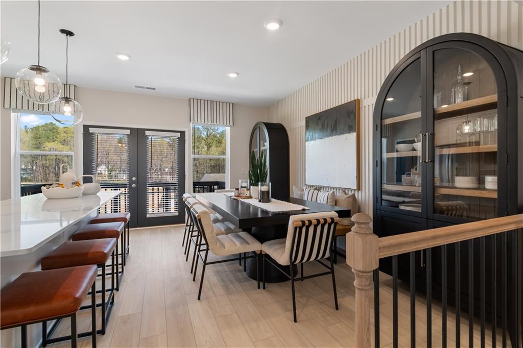 204 Daybreak Lane Newnan, GA 30265 - Photo 12 of 48 a view of a dining room with furniture window and wooden floor