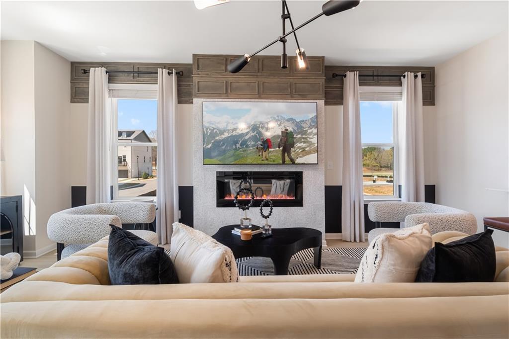 204 Daybreak Lane Newnan, GA 30265 - Photo 25 of 48 a living room with furniture and a large window