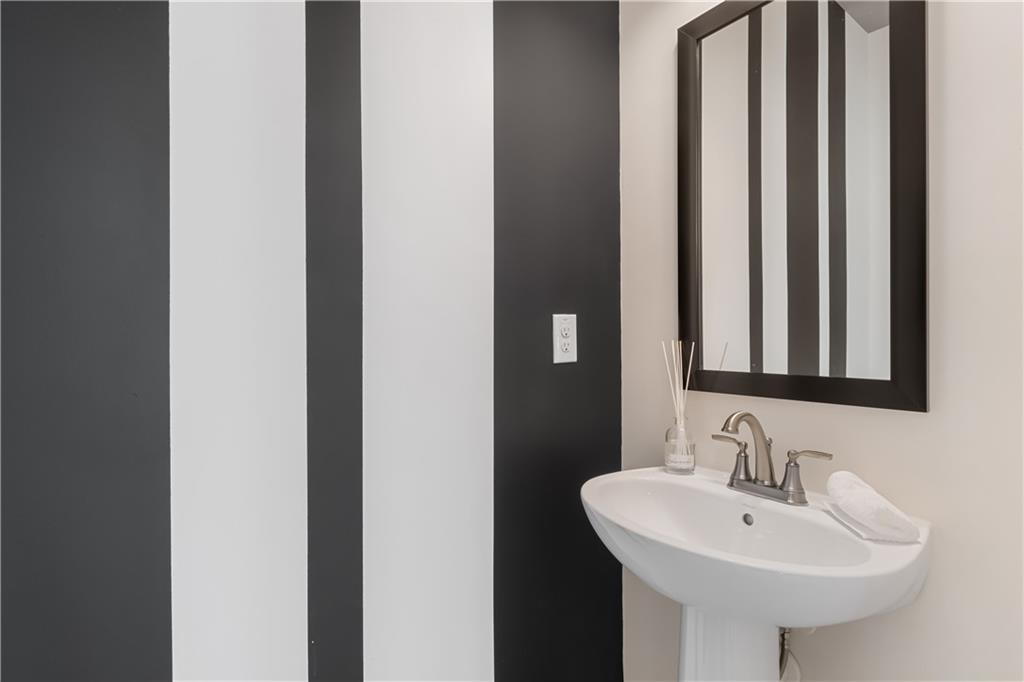 204 Daybreak Lane Newnan, GA 30265 - Photo 29 of 48 a bathroom with a sink and a mirror