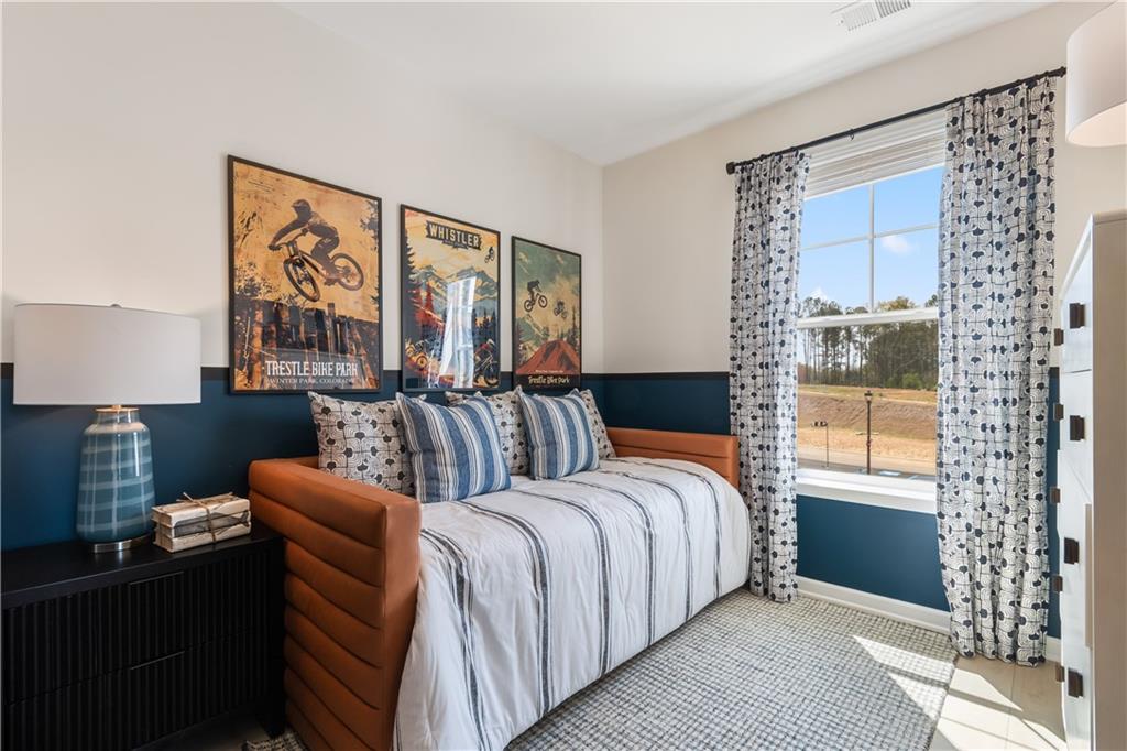 204 Daybreak Lane Newnan, GA 30265 - Photo 31 of 48 a bedroom with a large bed and a window