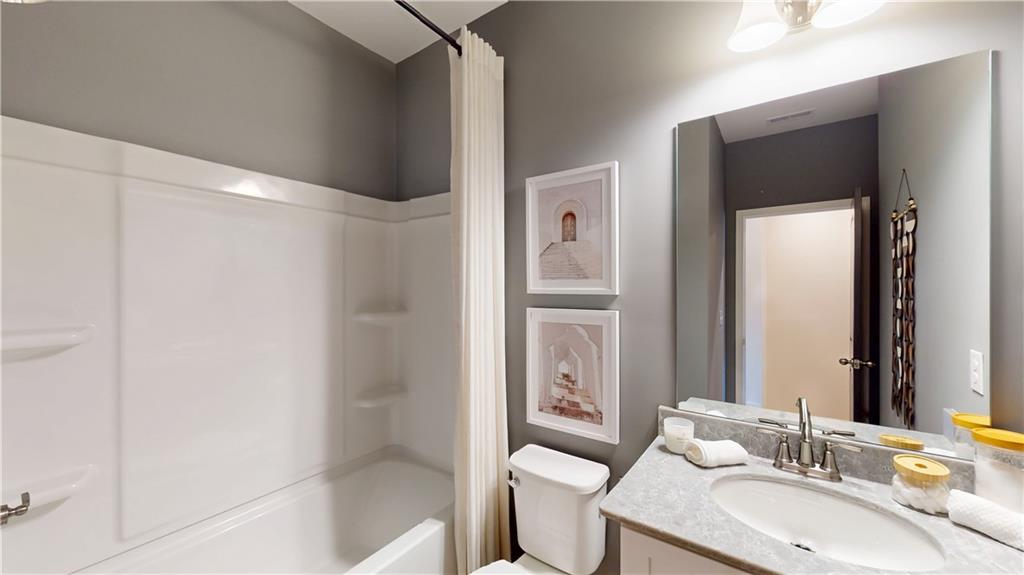 204 Daybreak Lane Newnan, GA 30265 - Photo 32 of 48 a bathroom with a sink toilet and shower