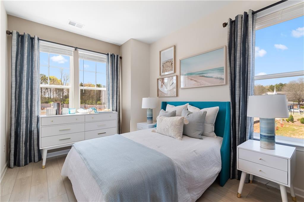 204 Daybreak Lane Newnan, GA 30265 - Photo 33 of 48 a bedroom with a large bed and a window