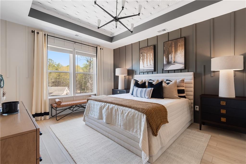 204 Daybreak Lane Newnan, GA 30265 - Photo 36 of 48 a spacious bedroom with a large bed and a window