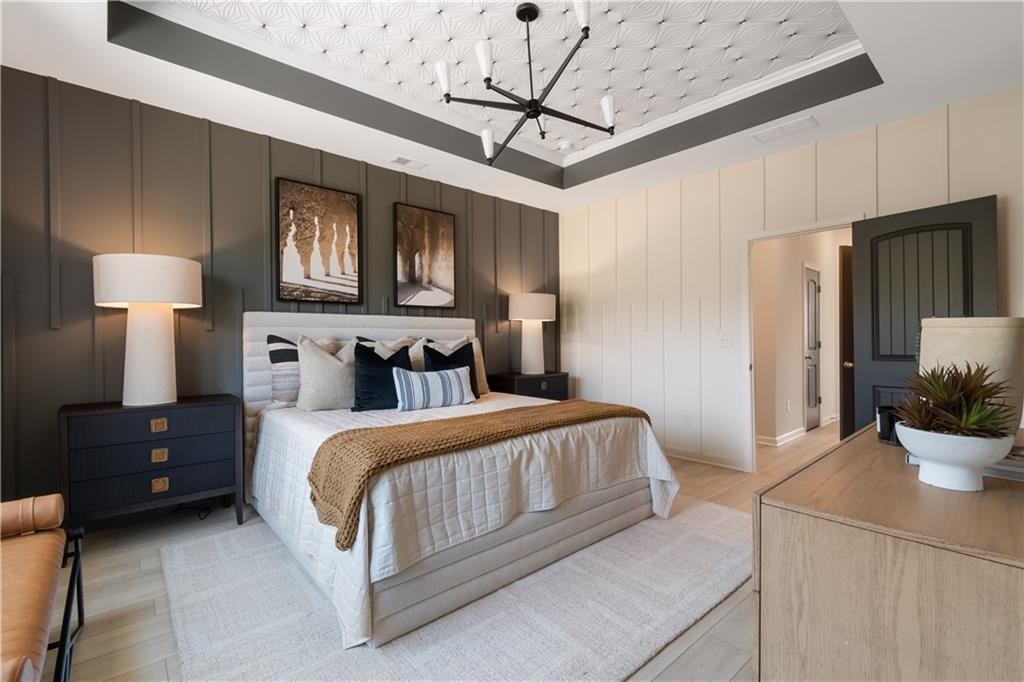 204 Daybreak Lane Newnan, GA 30265 - Photo 39 of 48 a bedroom with bed and a potted plant