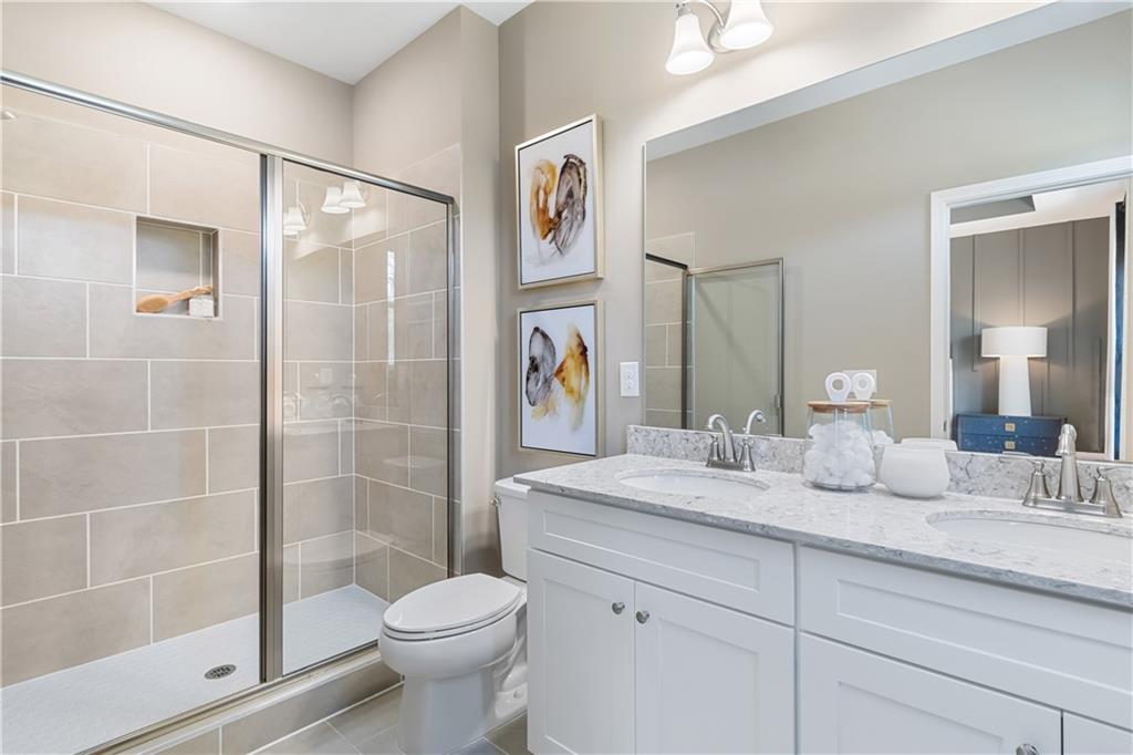 204 Daybreak Lane Newnan, GA 30265 - Photo 40 of 48 a bathroom with a sink toilet and shower