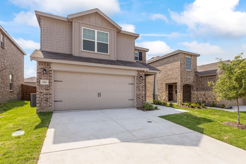 816 Breakwater Drive Princeton, TX 75407 - Photo 1 of 30 a front view of a house with a yard and garage
