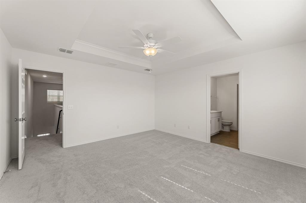 816 Breakwater Drive Princeton, TX 75407 - Photo 17 of 30 a view of an empty room with a ceiling fan