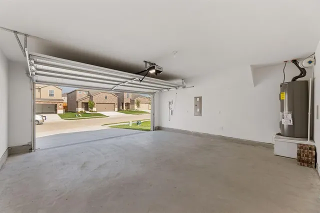 a view of a livingroom with wooden floor and a sink