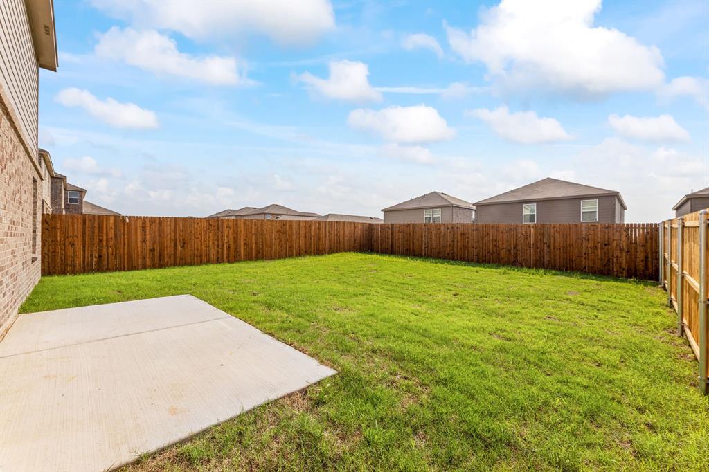 816 Breakwater Drive Princeton, TX 75407 - Photo 29 of 30 a view of a backyard with grass
