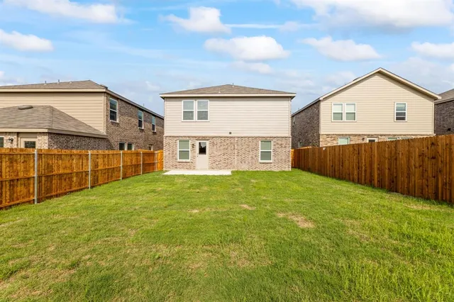 a view of a backyard of the house