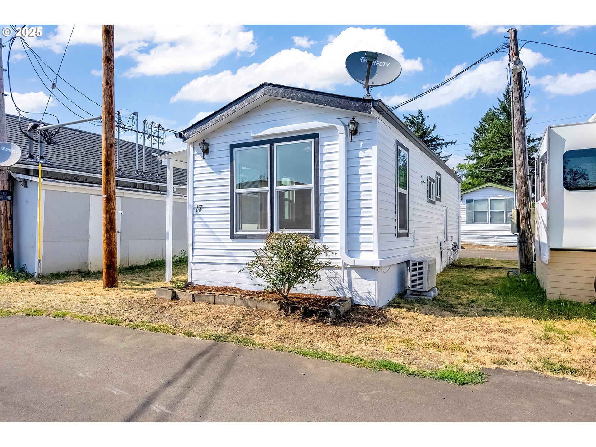 12726 Southeast Division Street, Unit 17 Portland, OR 97236 - Photo 2 of 26 a front view of a house with garden
