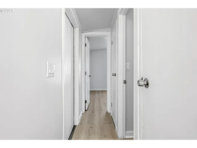 a view of a bathroom from a hallway