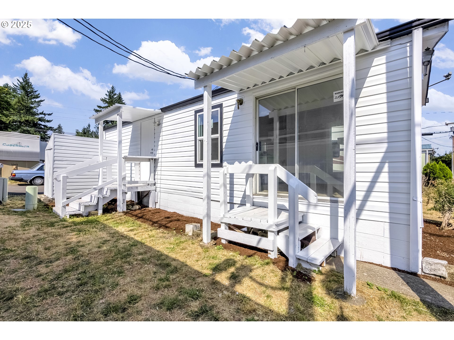 12726 Southeast Division Street, Unit 17 Portland, OR 97236 - Photo 5 of 26 a view of a house with backyard