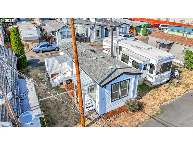 a aerial view of a house with a yard