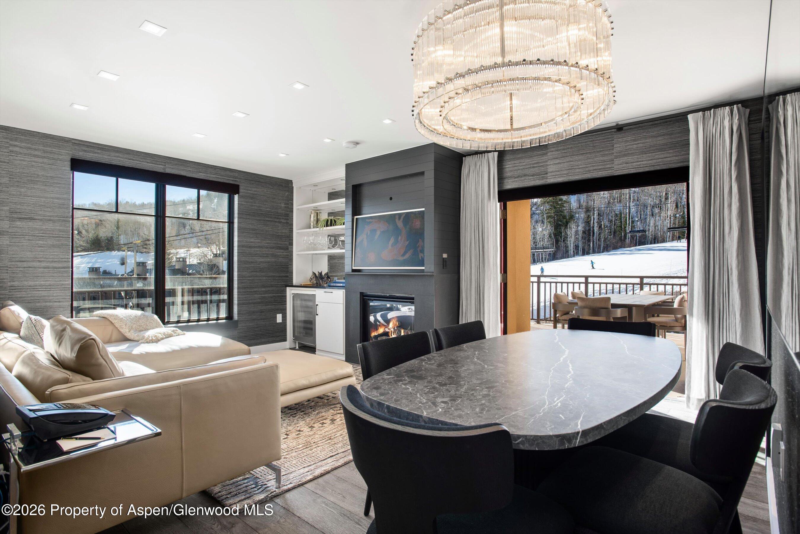 130 Wood Road, Unit 532 Snowmass Village, CO 81615 - Photo 3 of 15 a view of a dining room with furniture window and outside view
