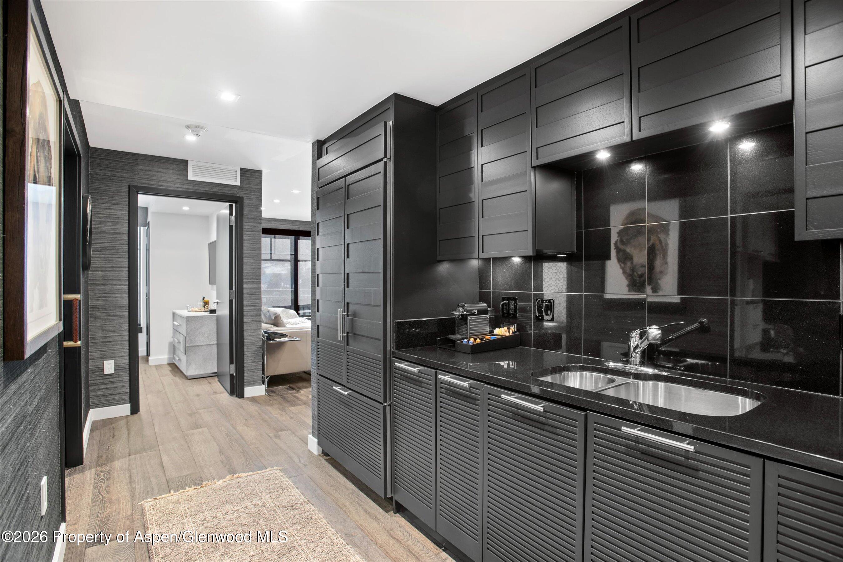 130 Wood Road, Unit 532 Snowmass Village, CO 81615 - Photo 7 of 15 a bathroom with a sink double vanity and a shower