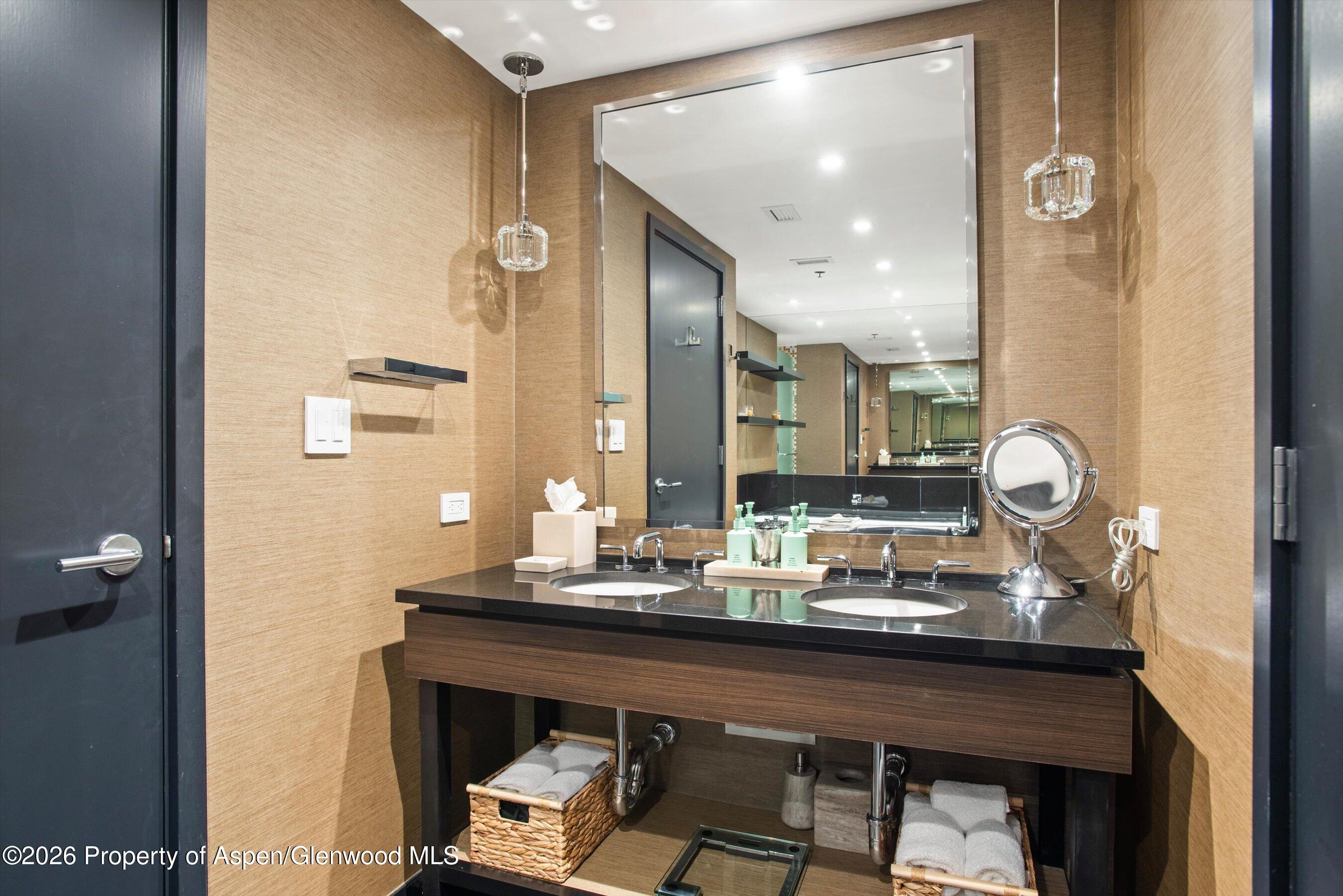 130 Wood Road, Unit 532 Snowmass Village, CO 81615 - Photo 10 of 15 a bathroom with a sink and a mirror