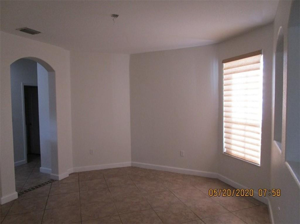 1734 Southwest 151 Place Miami, FL 33185 - Photo 11 of 12 a view of an empty room with a window