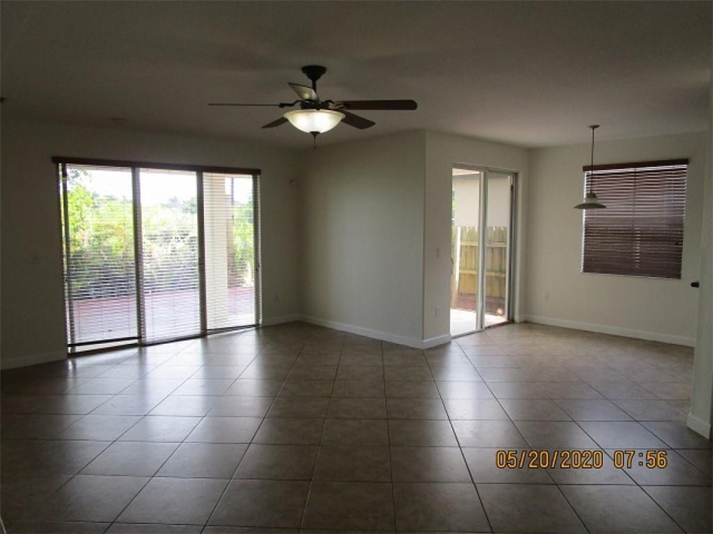 1734 Southwest 151 Place Miami, FL 33185 - Photo 2 of 12 a view of an empty room with glass door and a window