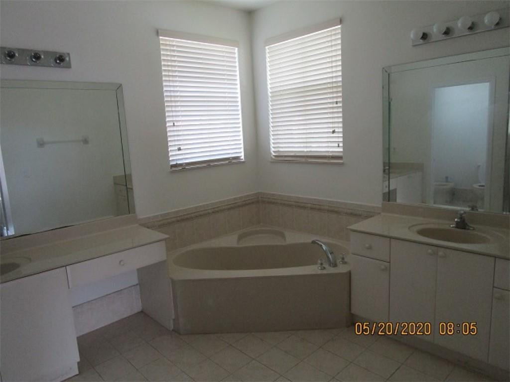 1734 Southwest 151 Place Miami, FL 33185 - Photo 6 of 12 a bathroom with a bathtub and a sink