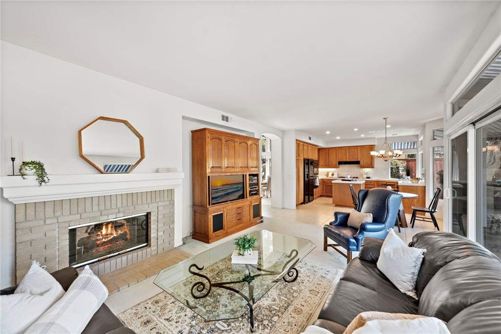 1775 Blackbird Circle Carlsbad, CA 92011 - Photo 19 of 32 a living room with furniture and a fireplace