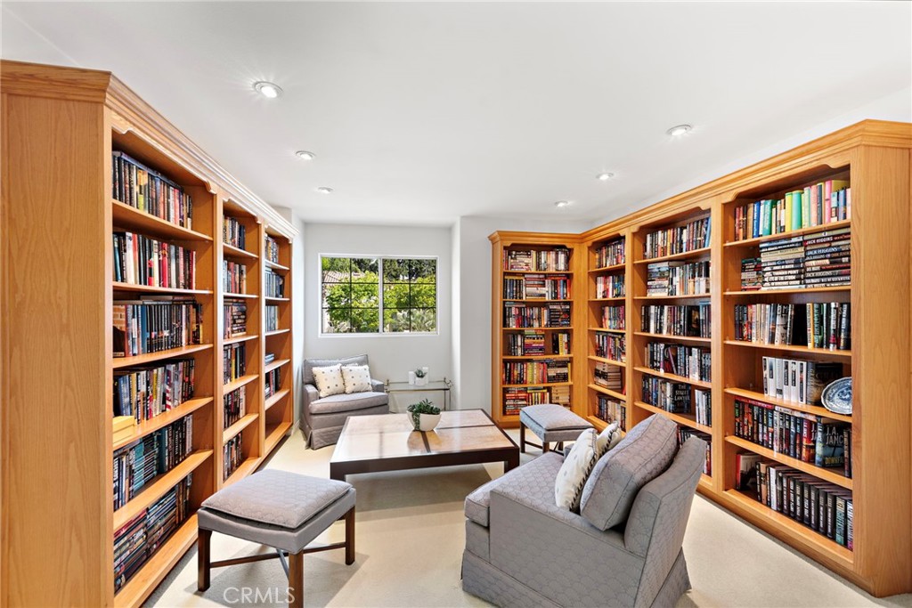 1775 Blackbird Circle Carlsbad, CA 92011 - Photo 29 of 32 a living room with furniture and a book shelf