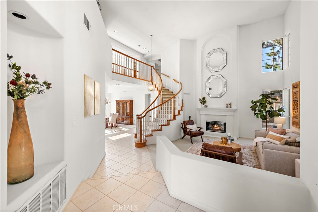 1775 Blackbird Circle Carlsbad, CA 92011 - Photo 7 of 32 a living room with furniture and a potted plant