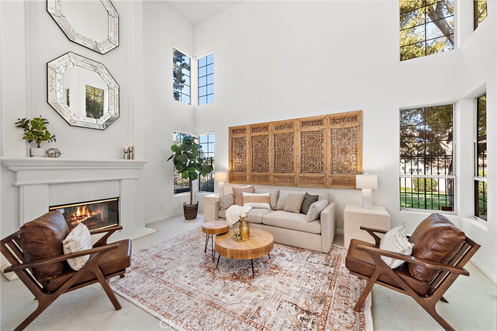 1775 Blackbird Circle Carlsbad, CA 92011 - Photo 8 of 32 a living room with furniture and a fireplace