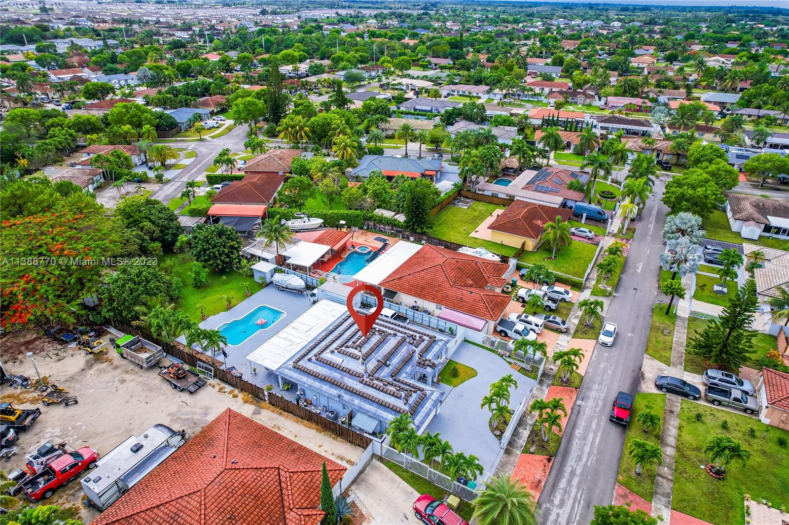 an aerial view of a houses with a yard