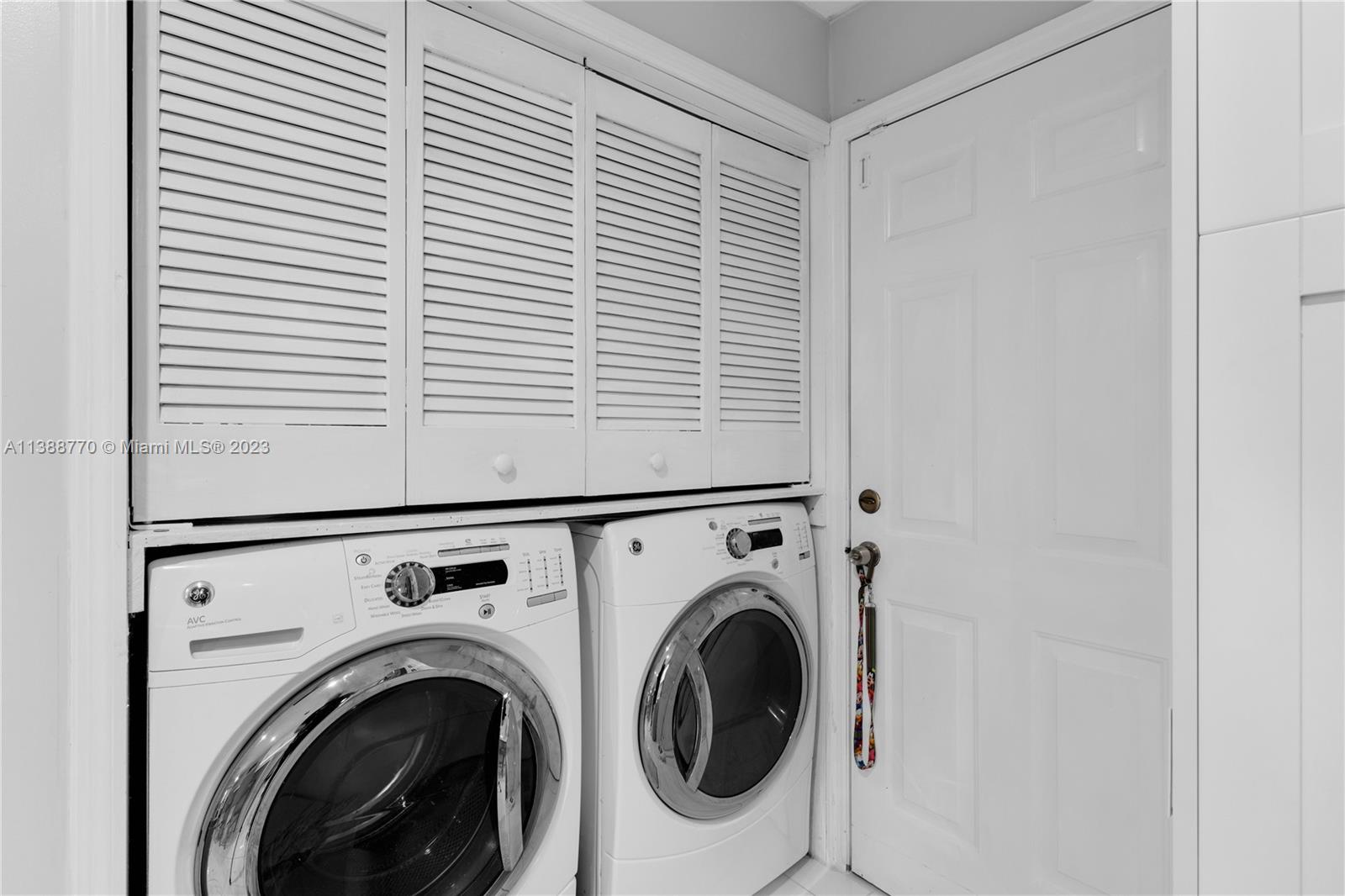 12458 Southwest 220th Street Miami, FL 33170 - Photo 18 of 25 a view of washer and dryer in a utility room