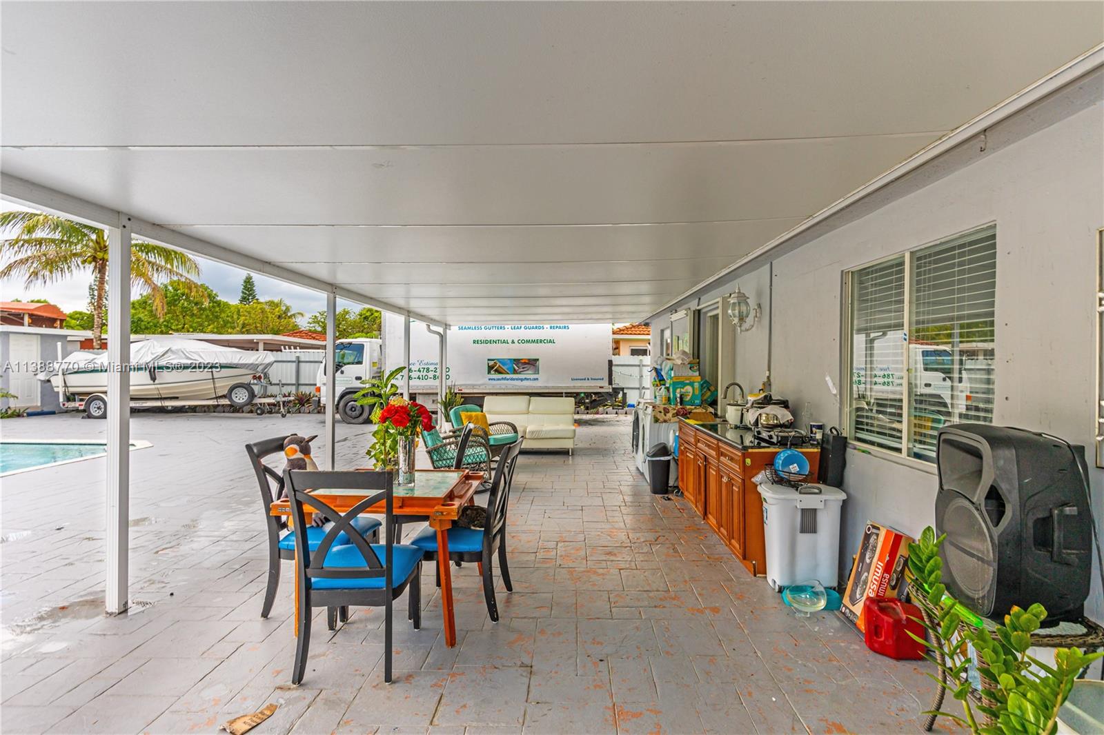 12458 Southwest 220th Street Miami, FL 33170 - Photo 24 of 25 a view of a patio with dining table and chairs