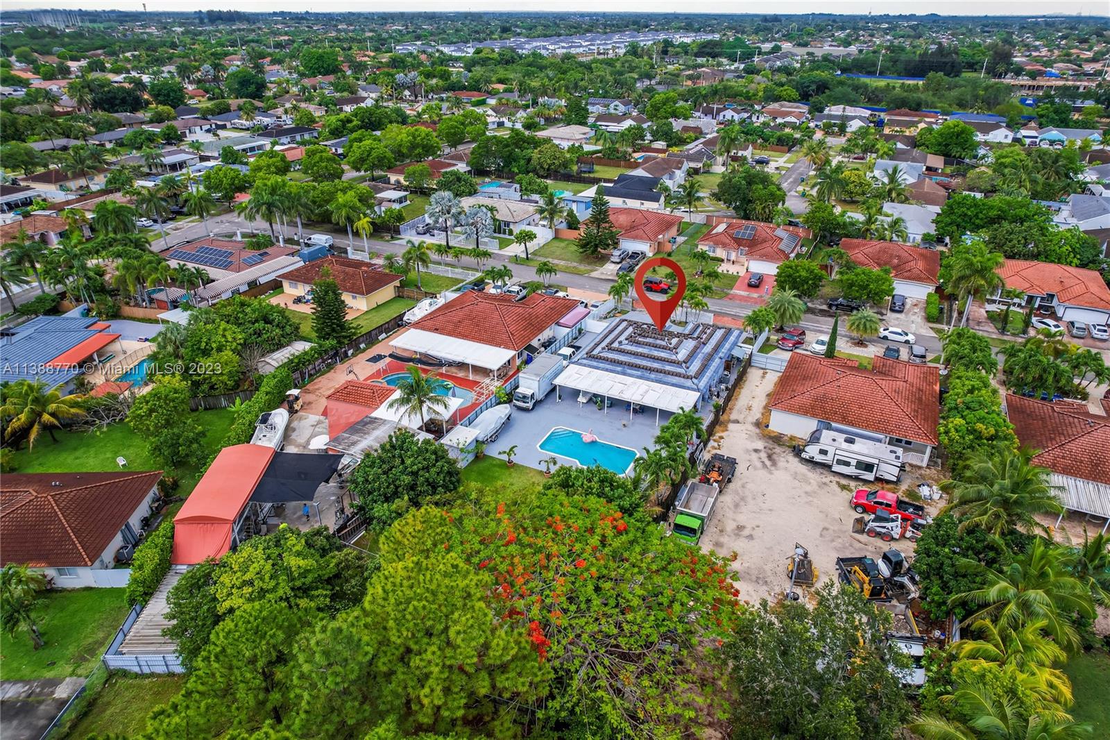12458 Southwest 220th Street Miami, FL 33170 - Photo 25 of 25 an aerial view of residential houses with outdoor space and trees all around
