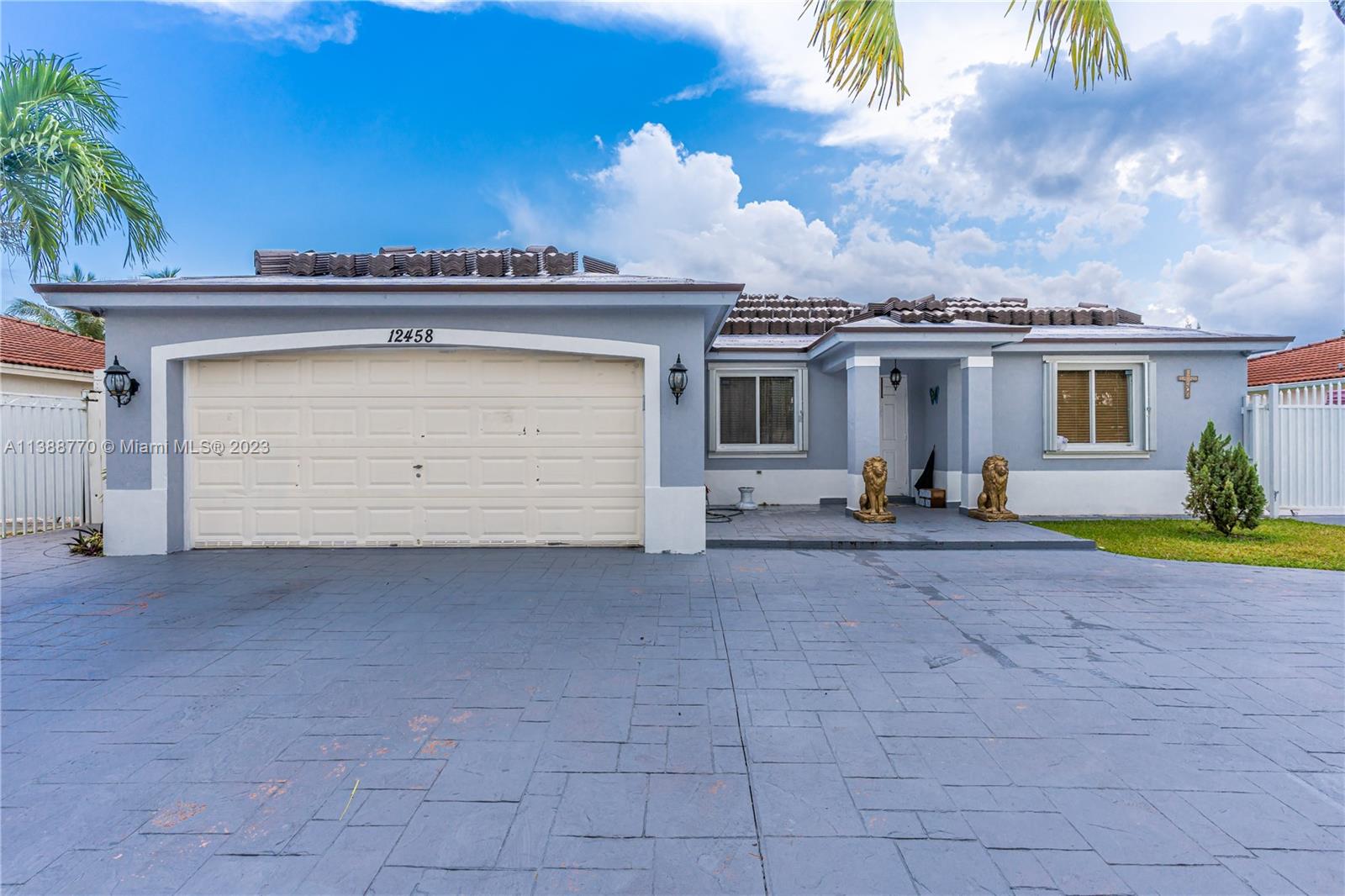12458 Southwest 220th Street Miami, FL 33170 - Photo 5 of 25 front view of house with a outdoor space