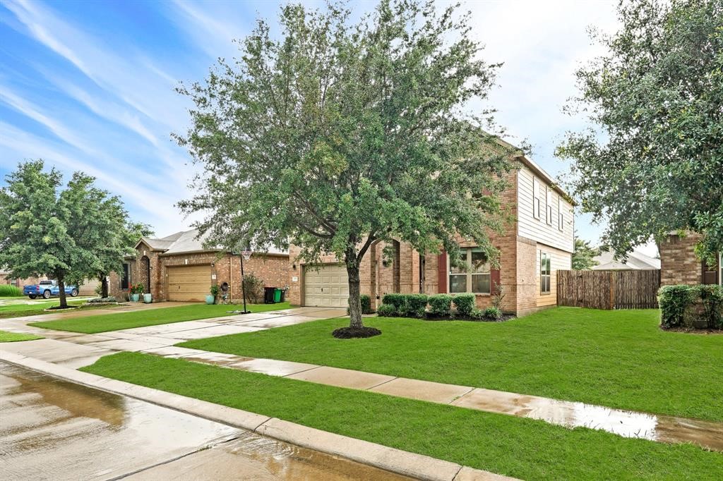 6719 Path Way Court Katy, TX 77449 - Photo 2 of 35 a garden with trees in front of it