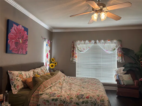 a bedroom with a bed and lamp