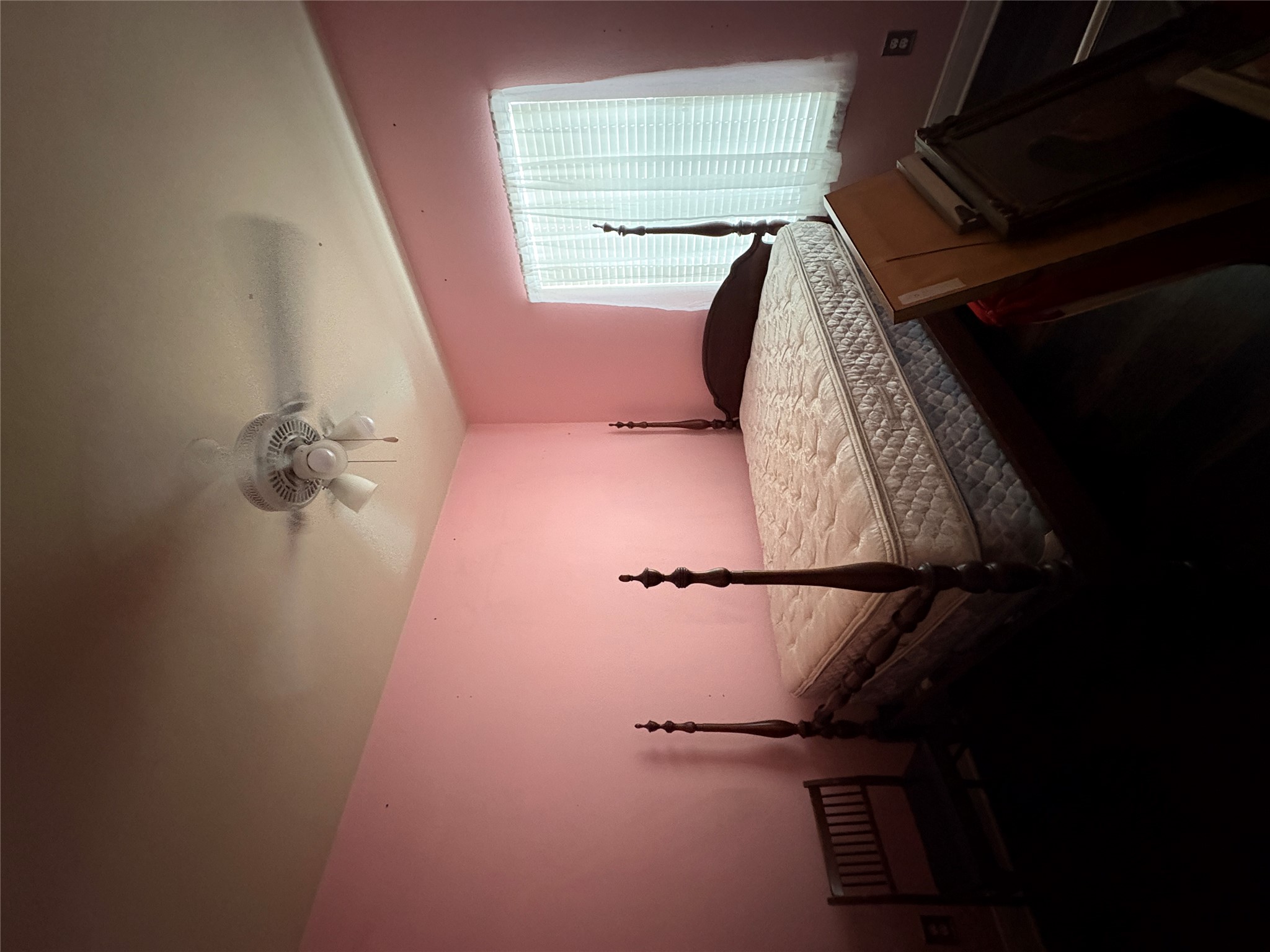 113 Canyon Road Georgetown, TX 78628 - Photo 16 of 21 a bedroom with a bed and a chandelier