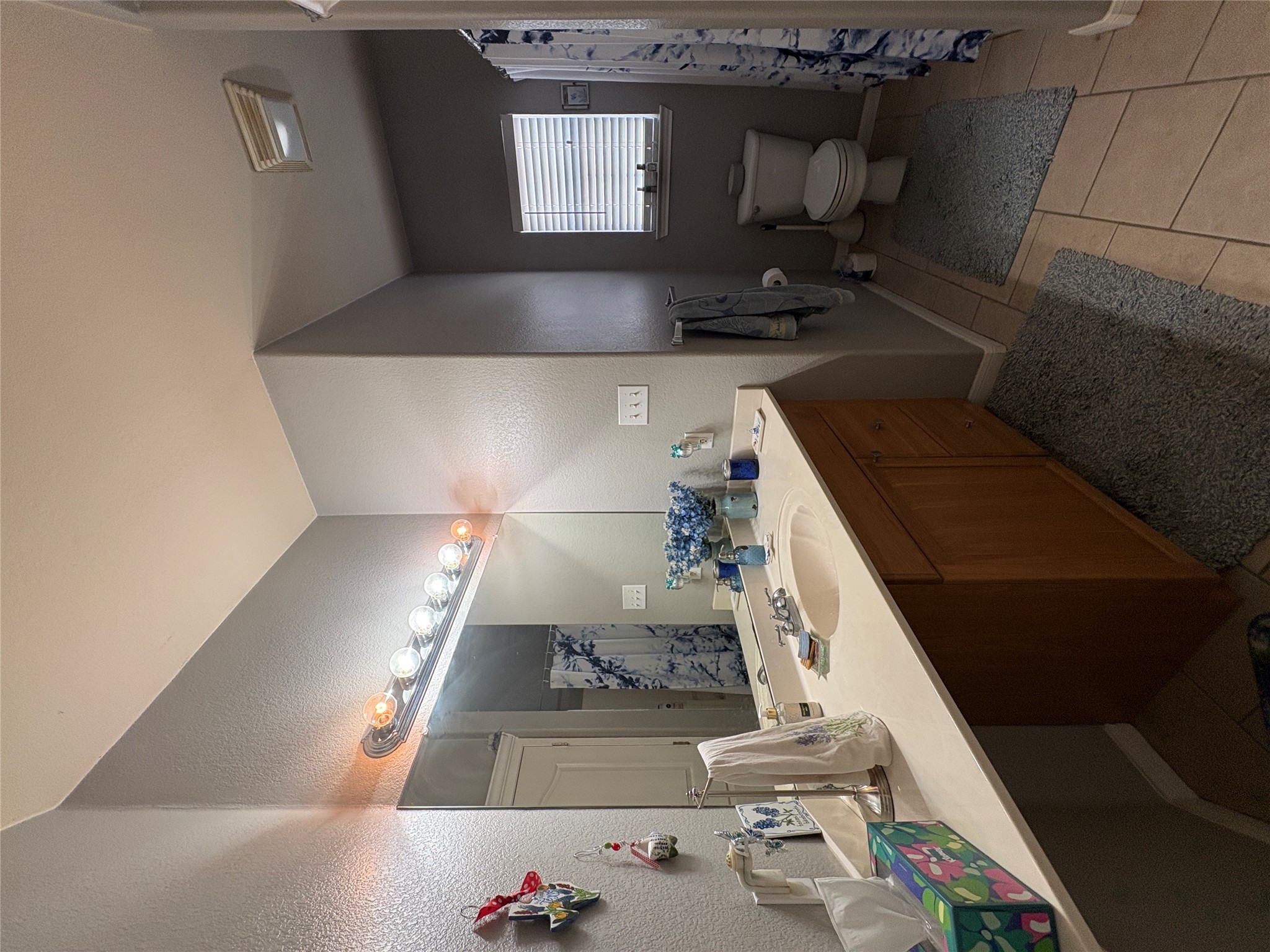 113 Canyon Road Georgetown, TX 78628 - Photo 18 of 21 a bathroom with a sink and a mirror