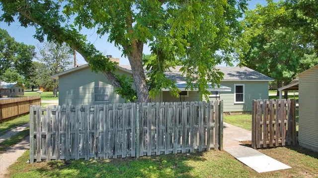 a house view with a backyard space