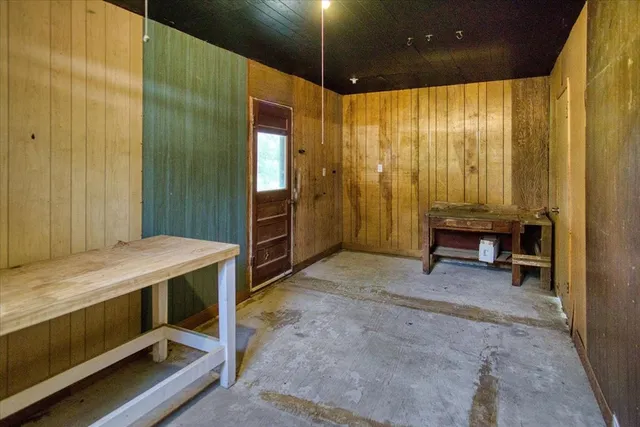 a view of a backyard with wooden floor and roof
