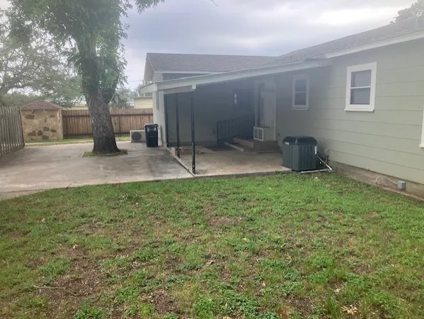 a backyard of a house with lots of green space