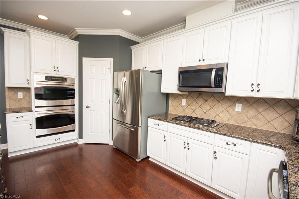4608 River Valley Road High Point, NC 27265 - Photo 2 of 28 Kitchen lovers dream. Gas cook top with 5 burners, built in oven and microwave.