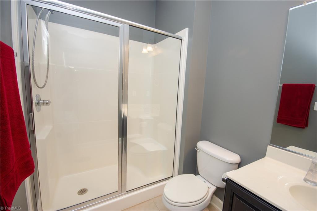 4608 River Valley Road High Point, NC 27265 - Photo 13 of 28 Main level full bath makes the downstairs bedroom great for overnight guests or in-law area!
