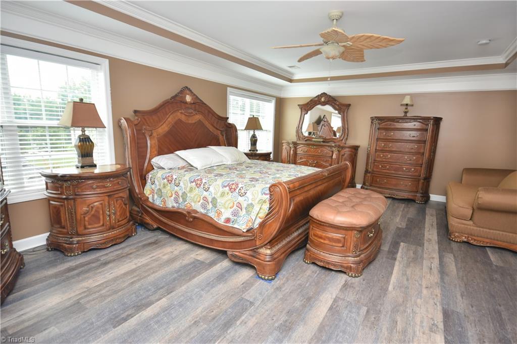 4608 River Valley Road High Point, NC 27265 - Photo 14 of 28 Large Master Bedroom complete with tray ceiling and ceiling fan.