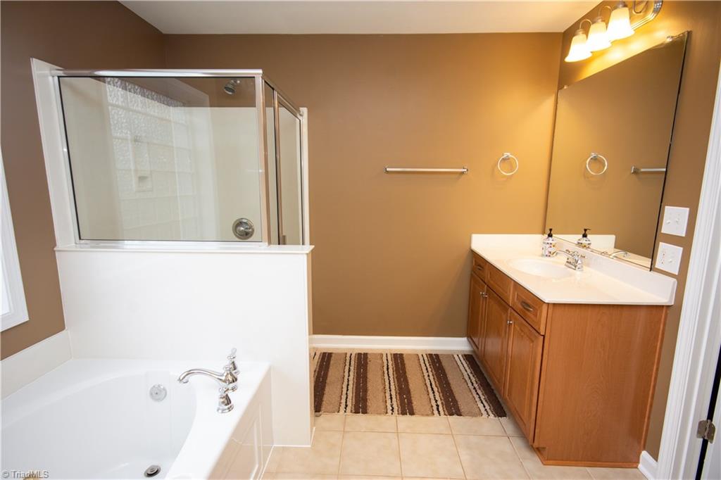 4608 River Valley Road High Point, NC 27265 - Photo 17 of 28 His sink, separate shower and garden tub, means this bath room has it all!!