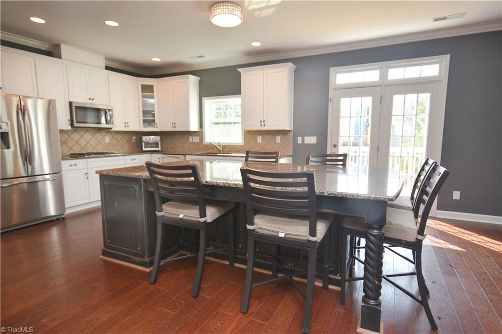 4608 River Valley Road High Point, NC 27265 - Photo 4 of 28 Bright open kitchen with great views of the deck.