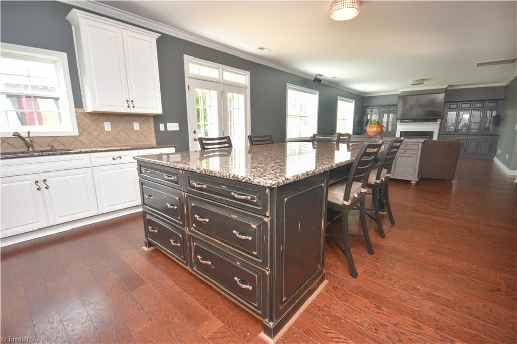 4608 River Valley Road High Point, NC 27265 - Photo 5 of 28 Custom island with 9 x 5 granite top!! Notice the additional storage in the island.