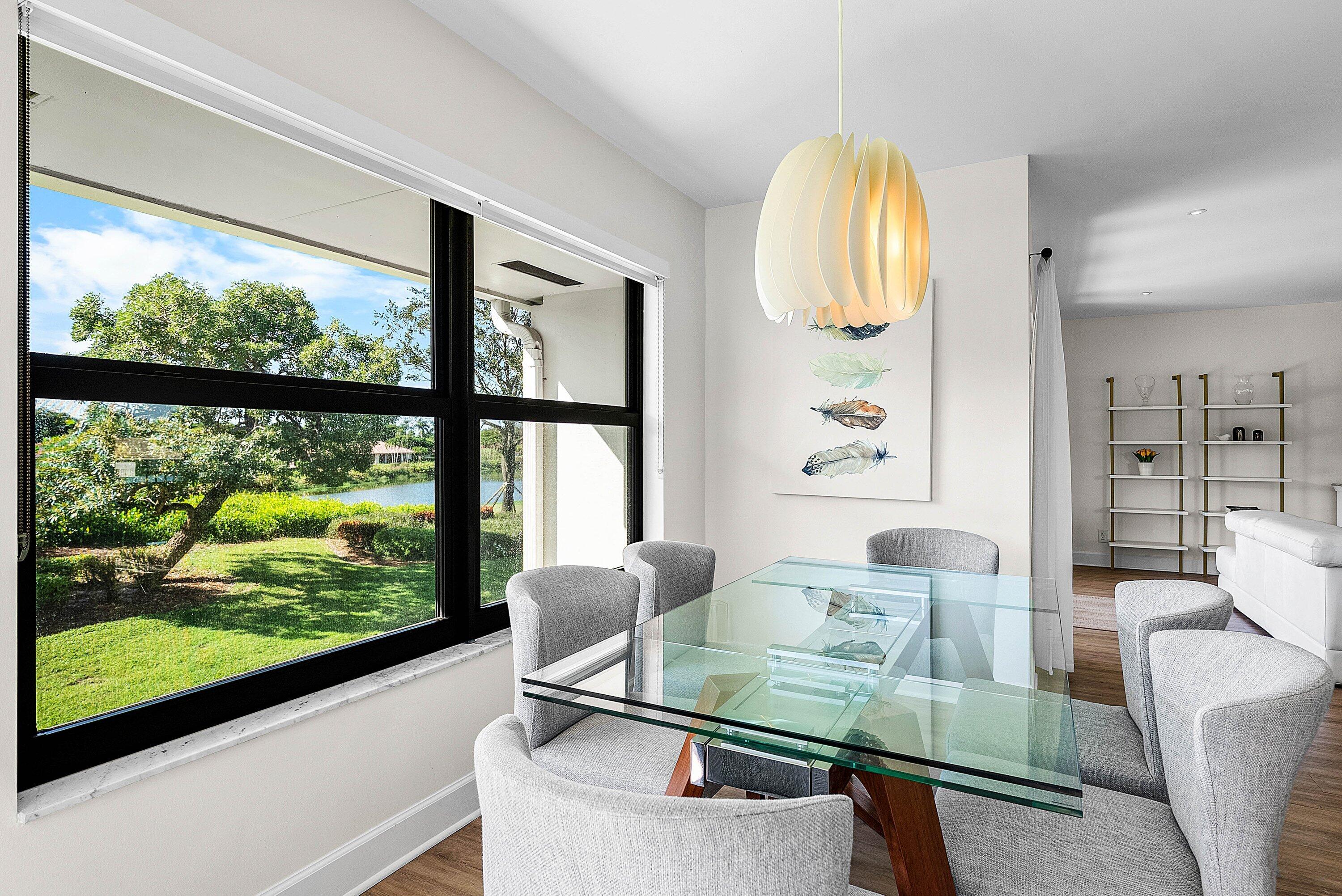 10301 Quail Covey Road, Unit HIBISCUS S Boynton Beach, FL 33436 - Photo 15 of 55 a living room with furniture and a large window