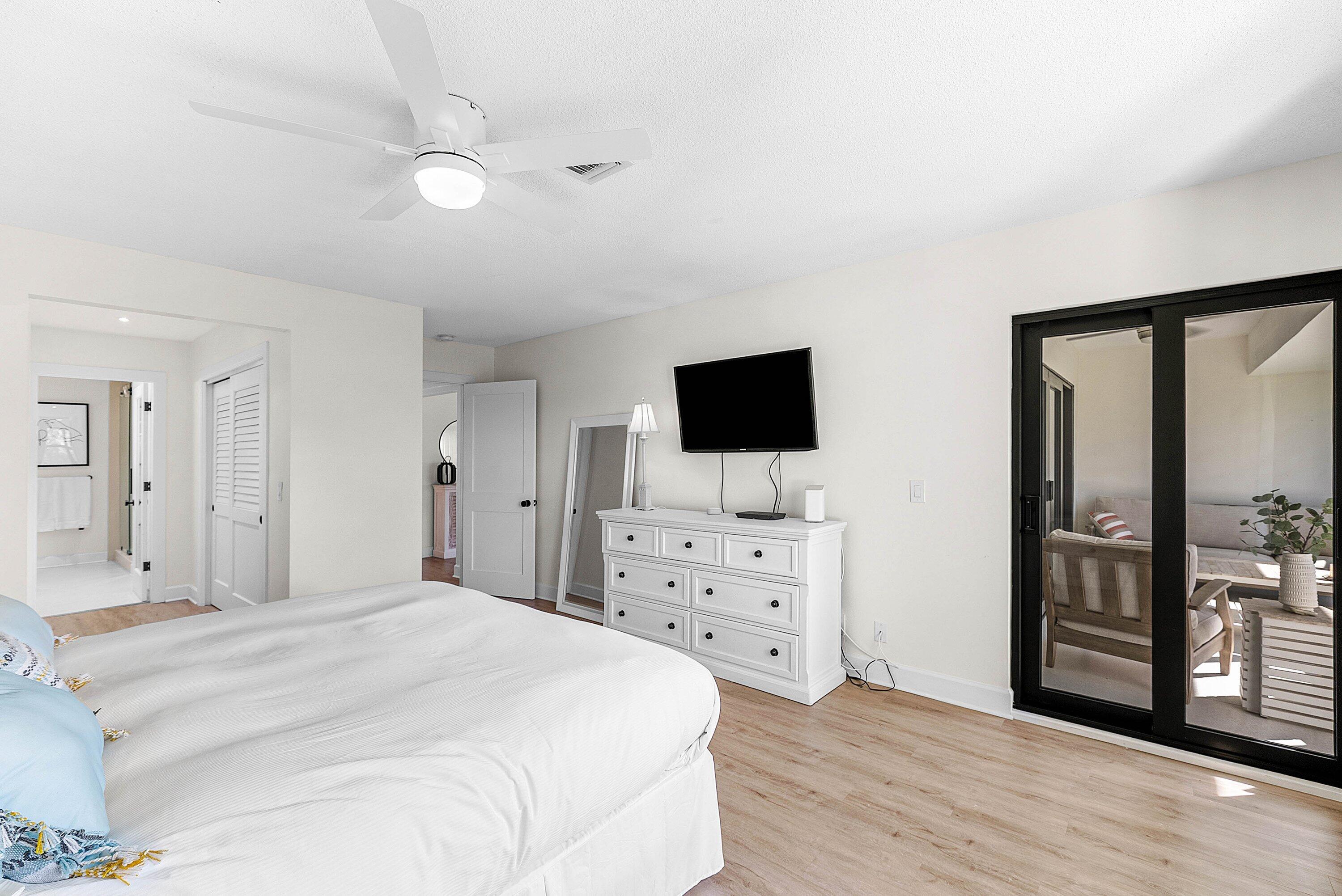 10301 Quail Covey Road, Unit HIBISCUS S Boynton Beach, FL 33436 - Photo 23 of 55 a bedroom with a bed and a flat screen tv