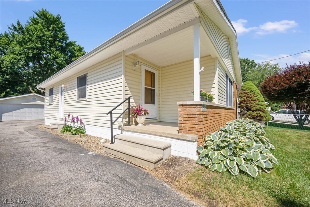1586 Norledge Road Akron, OH 44305 - Photo 2 of 24 View of front facade featuring an outdoor structure and a detached garage