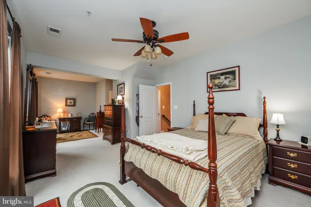 a bed room with furniture and a flat screen tv